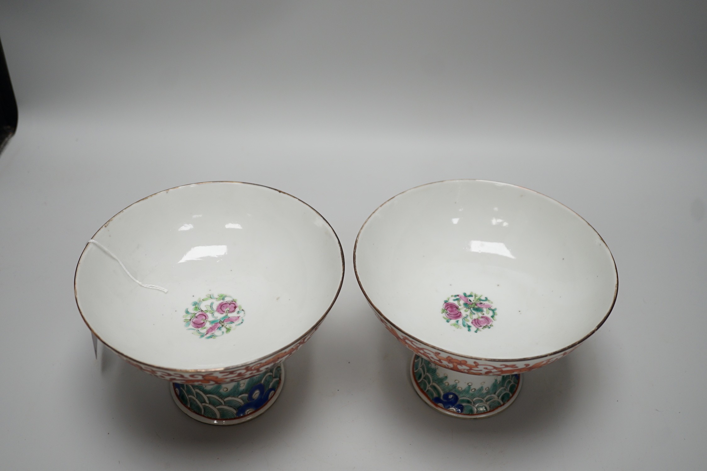 A large pair of 19th century Chinese stem bowls, painted with bats, Shou and lotus flowers, 12cm tall